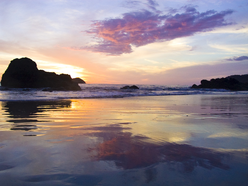 Sunset From Playa Espadilla Reflected In Wet Sand